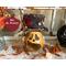 This is a Halloween pumpkin decoration. It is a carved gourd with a black top hat. His name is Mr. Willably. 